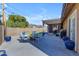 Backyard patio with pergola, fire pit, seating area, and landscaping at 10232 E Fortuna Ave, Gold Canyon, AZ 85118