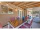 Covered patio with dining table and string lights at 10232 E Fortuna Ave, Gold Canyon, AZ 85118