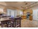 Kitchen with oak cabinets, stainless steel appliances, and a dining area at 10232 E Fortuna Ave, Gold Canyon, AZ 85118