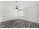 Simple bedroom with gray vinyl flooring and ceiling fan at 11020 N 13Th St, Phoenix, AZ 85020