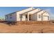 New construction home with a two-car garage, and desert landscaping at 1207 N 362Nd Ave, Tonopah, AZ 85354