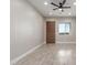 Bright and airy living room with tile floors and ceiling fan at 1207 N 362Nd Ave, Tonopah, AZ 85354