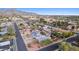 Aerial view of a house and surrounding neighborhood, featuring a large backyard and mountain views at 1301 E Kaler Dr, Phoenix, AZ 85020