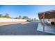 Large gravel backyard with covered patio area at 14821 N 51St Dr, Glendale, AZ 85306