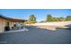 Large backyard with gravel, covered patio, and space for outdoor furniture at 14821 N 51St Dr, Glendale, AZ 85306