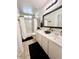 Updated bathroom with double vanity, bathtub, and tiled flooring at 14821 N 51St Dr, Glendale, AZ 85306