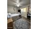 Spacious bedroom with a queen bed and window at 14821 N 51St Dr, Glendale, AZ 85306