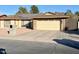 Single-story home with solar panels and attached two-car garage at 14821 N 51St Dr, Glendale, AZ 85306