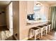Eat-in kitchen with breakfast bar and granite counters at 14821 N 51St Dr, Glendale, AZ 85306