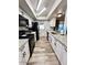 Modern kitchen with white cabinets and granite counters at 14821 N 51St Dr, Glendale, AZ 85306