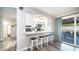 Kitchen with breakfast bar and view into the backyard at 14821 N 51St Dr, Glendale, AZ 85306