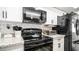 Granite countertops and black appliances in this updated kitchen at 14821 N 51St Dr, Glendale, AZ 85306