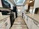 Modern kitchen with granite countertops, white cabinets, and stainless steel appliances at 14821 N 51St Dr, Glendale, AZ 85306