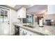 Kitchen features a granite countertop and stainless steel sink at 14821 N 51St Dr, Glendale, AZ 85306