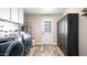 Laundry room with washer, dryer, and extra storage at 14821 N 51St Dr, Glendale, AZ 85306