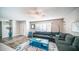 Bright living room with comfy sectional sofa and a blue coffee table at 14821 N 51St Dr, Glendale, AZ 85306