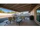 Relaxing covered patio with seating area, perfect for outdoor entertaining at 14821 N 51St Dr, Glendale, AZ 85306