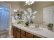 Bathroom with double sinks and a shower at 15791 W Westview Dr, Goodyear, AZ 85395