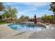 Inviting kidney-shaped pool with a waterfall feature at 15791 W Westview Dr, Goodyear, AZ 85395