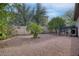 Landscaped side yard with gravel and mature trees at 15791 W Westview Dr, Goodyear, AZ 85395