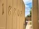 House number 18802 displayed on a light beige wood gate at 18802 N 44Th Pl, Phoenix, AZ 85050
