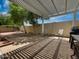 Landscaped backyard with pergola-covered patio and seating area at 18802 N 44Th Pl, Phoenix, AZ 85050