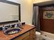 Bathroom with tiled shower and decorative sink at 18802 N 44Th Pl, Phoenix, AZ 85050