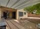 Covered patio with pergola, outdoor grill, and seating area at 18802 N 44Th Pl, Phoenix, AZ 85050