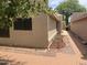 Landscaped side yard with brick pathway and lighting at 18802 N 44Th Pl, Phoenix, AZ 85050