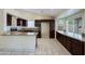 Kitchen with granite countertops and dark wood cabinets at 19431 N Central Ave, Phoenix, AZ 85024