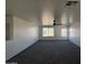 Large bonus room with two windows and ceiling fan at 22262 W Tonto St, Buckeye, AZ 85326