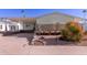 Single-wide manufactured home with carport and landscaped yard at 2229 N Higley Rd, Mesa, AZ 85215