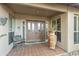 Elegant double front doors with glass inserts and a terracotta pot at 25639 S Beech Creek Dr, Sun Lakes, AZ 85248