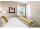 Bright bedroom with queen-size bed and large window at 2595 S Jeffry St, Gilbert, AZ 85295