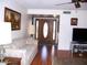 Living room with hardwood floors, neutral walls, and a ceiling fan at 26409 S Howard Dr, Sun Lakes, AZ 85248