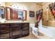 Bathroom featuring dark wood cabinets, granite countertops, and a tub/shower combo at 5301 E Via Buena Vis, Paradise Valley, AZ 85253