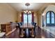 Elegant dining room with large table, dark wood furniture, and ornate details at 5301 E Via Buena Vis, Paradise Valley, AZ 85253