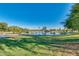 Serene park with a lake, lush greenery, and clear sky at 5414 N 78Th Pl, Scottsdale, AZ 85250