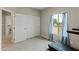 Bedroom with double doors to closet and views of backyard at 6293 N Telly Ln, Casa Grande, AZ 85194