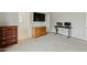 Spacious bedroom with large dresser, built-in desk and view into bathroom at 6293 N Telly Ln, Casa Grande, AZ 85194