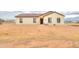 Single-story home with light-colored exterior and a front yard at 6293 N Telly Ln, Casa Grande, AZ 85194