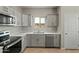 Modern kitchen with stainless steel appliances at 6293 N Telly Ln, Casa Grande, AZ 85194