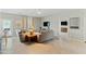 Open living room with gray couches and a view into another living space at 6293 N Telly Ln, Casa Grande, AZ 85194