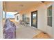 Covered patio with seating area, grill, and birdcage at 6293 N Telly Ln, Casa Grande, AZ 85194