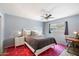 Bedroom with queen bed, desk, and ceiling fan at 6805 E 2Nd St # 4, Scottsdale, AZ 85251