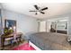Bedroom with queen bed, desk, and ceiling fan at 6805 E 2Nd St # 4, Scottsdale, AZ 85251