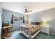 Spacious bedroom with a queen-size bed, a work desk and ceiling fan at 6805 E 2Nd St # 4, Scottsdale, AZ 85251
