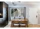 Small dining area with wood table and chairs, adjacent to kitchen at 6805 E 2Nd St # 4, Scottsdale, AZ 85251