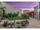 Landscaped backyard with artificial turf and sunset view at 8437 N 84Th Pl, Scottsdale, AZ 85258