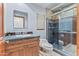 Bathroom with walk-in shower, single vanity, and wood cabinets at 8437 N 84Th Pl, Scottsdale, AZ 85258